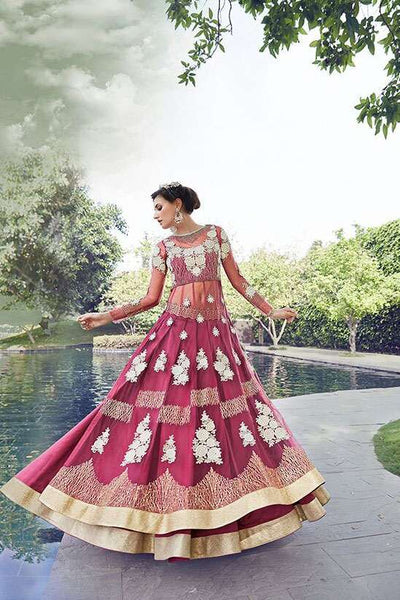 Stun in our shimmering Pink Zoya Crystal Lehenga, a luxurious choice for weddings & Asian party wear. Exquisite embroidery & sparkling crystals adorn this beautiful garment. Shop now for a dazzling look!